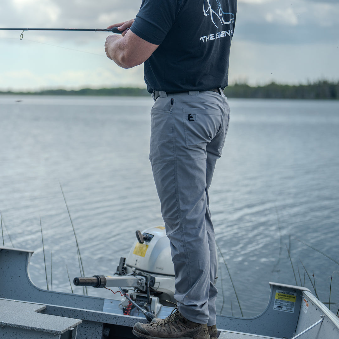 Man fishing wearing All Terrain Pants#color_original-bottomland