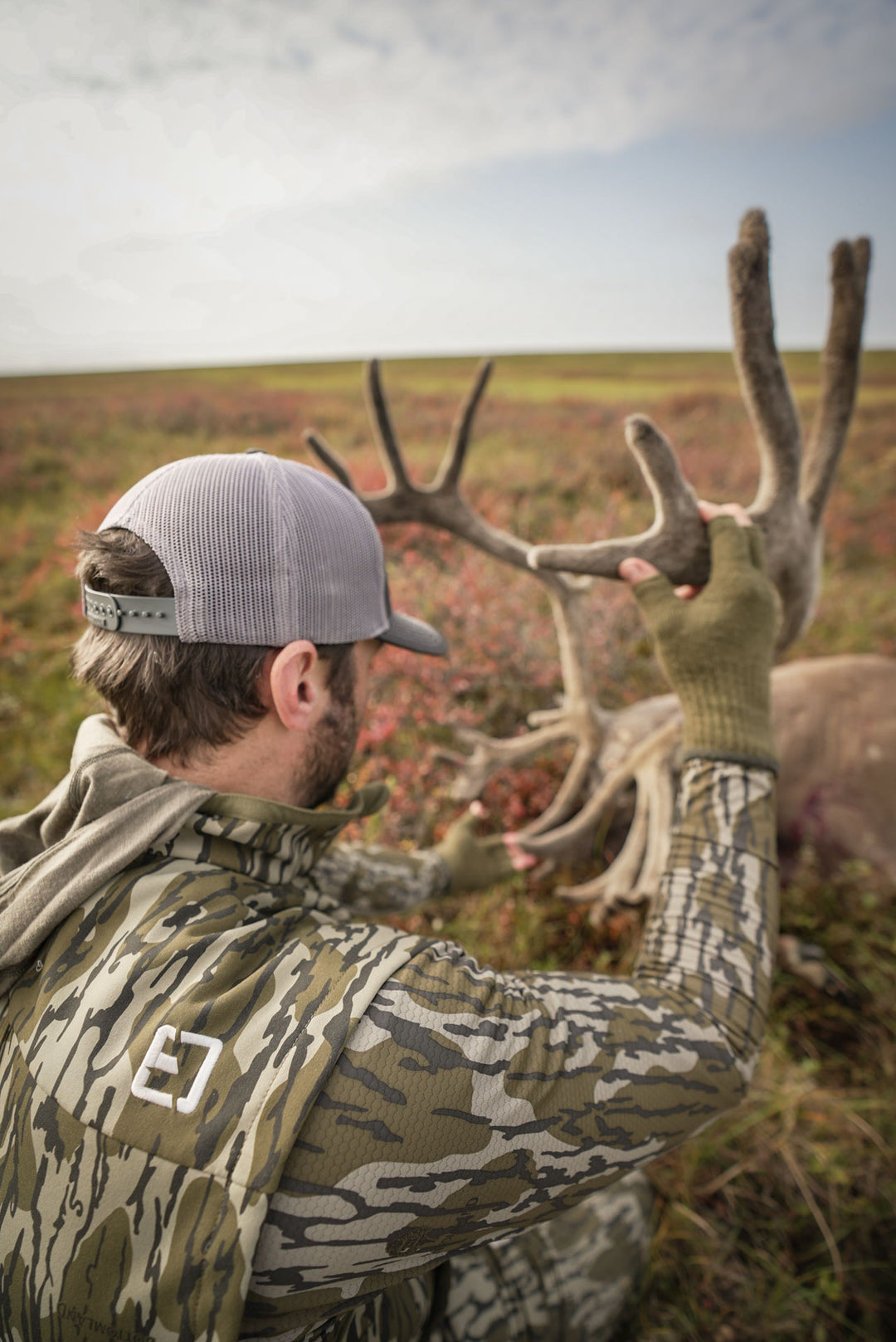 man admiring antlers #colors_original-bottomland