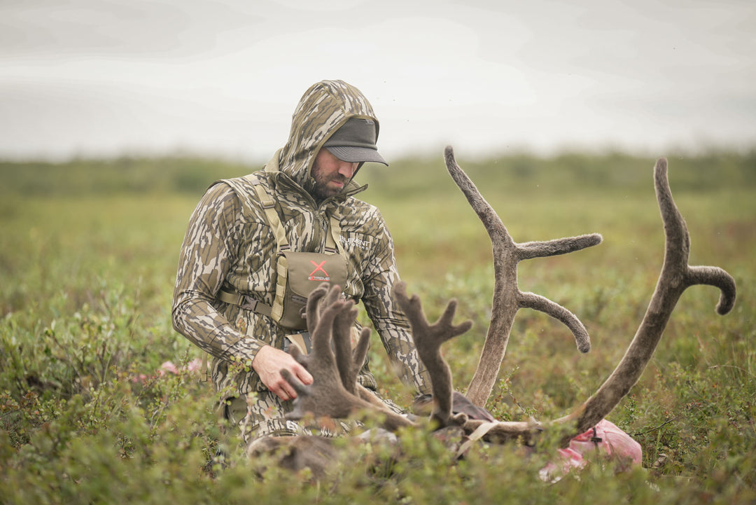 Man touching antlers #color_original-bottomland