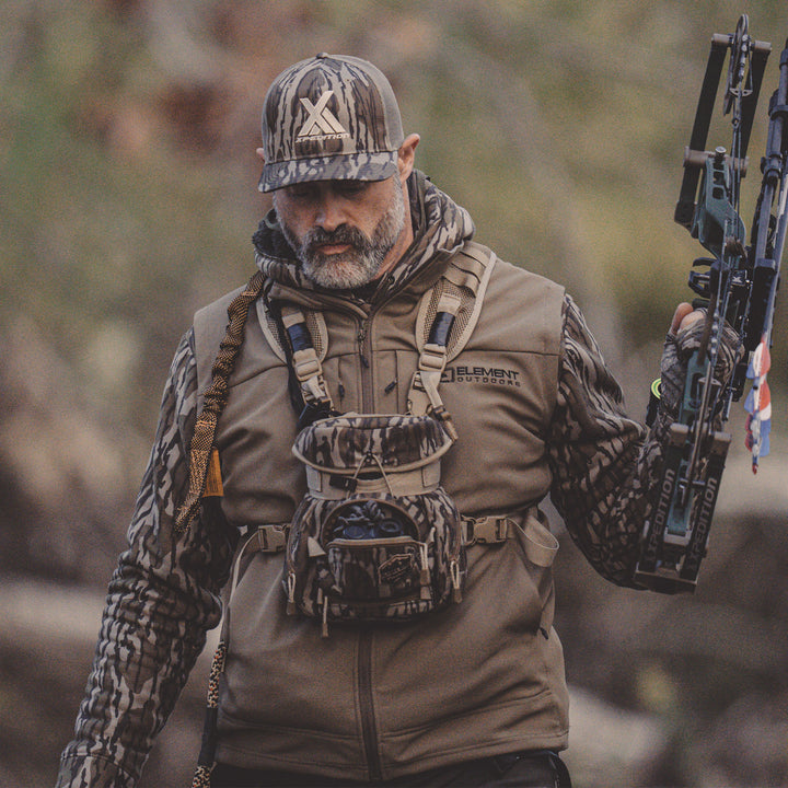 Hunter wearing Peak vest#color_original-bottomland